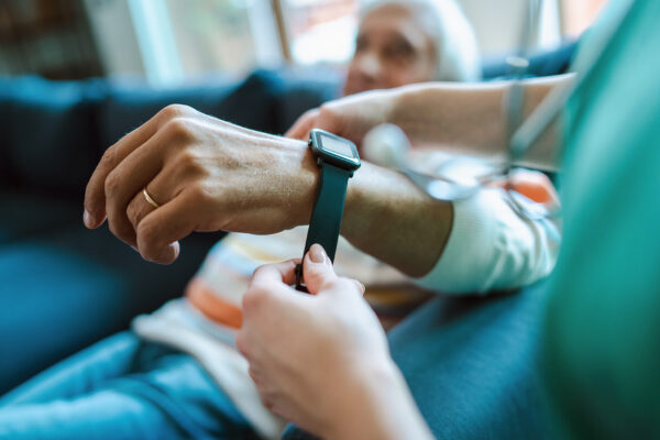 Smartwatch for assisted living. A woman from the medical health